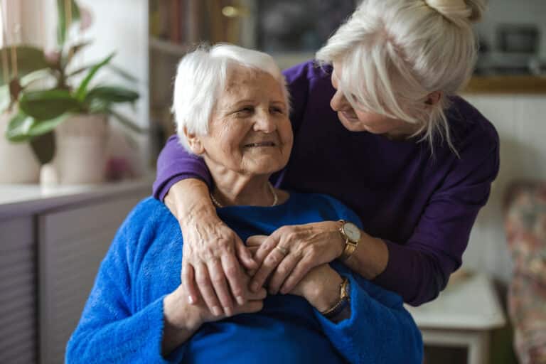 Woman hugging her elderly mother - How to Calm a Dementia Patient
